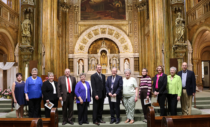 Commissioned members pose in Mary of the Angels Chapel