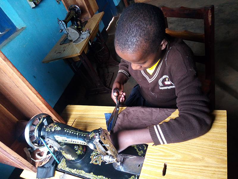 Tekla Kagera student learns to sew